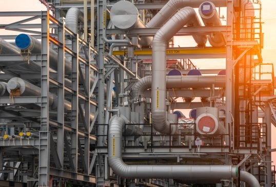 Crude Oil Refinery Plant Steel Pipe line and Chimney and Cooling tower, Chemical or Petrochemical factory plant power plant , Petrochemical tower tank industry concept.